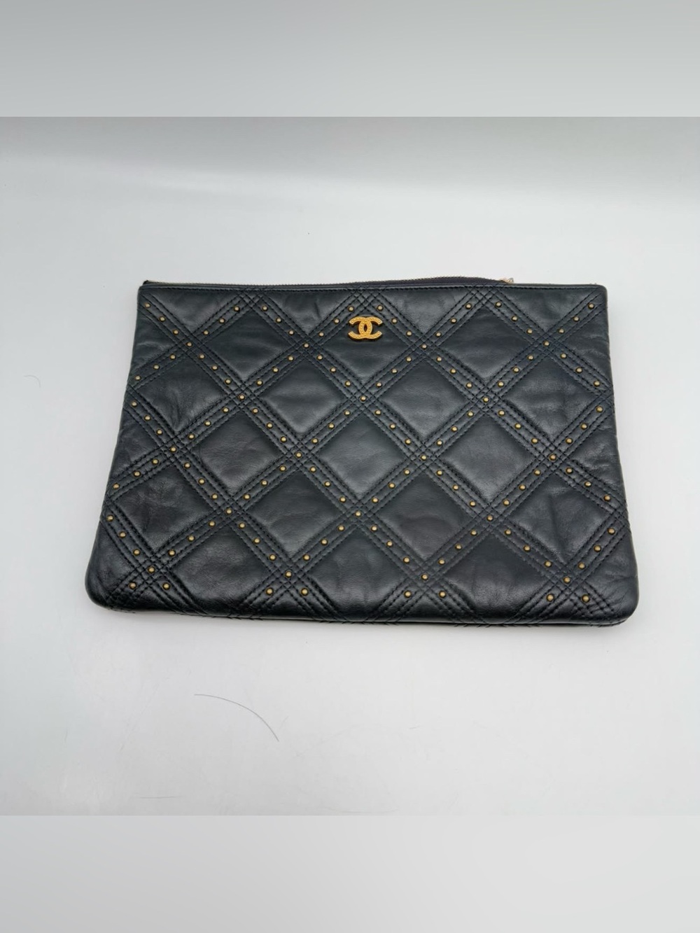 CHANEL Black Quilted Leather Clutch with Gold Stud Accents